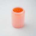 Orange portable pet paw cleaner cup with soft silicone brush