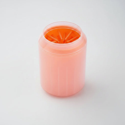 Orange portable pet paw cleaner cup with soft silicone brush