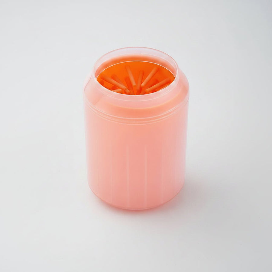 Orange portable pet paw cleaner cup with soft silicone brush