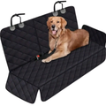 Dog lying on a black car seat cover with quilted pattern