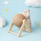 White cat playing with a wooden sisal scratching ball toy